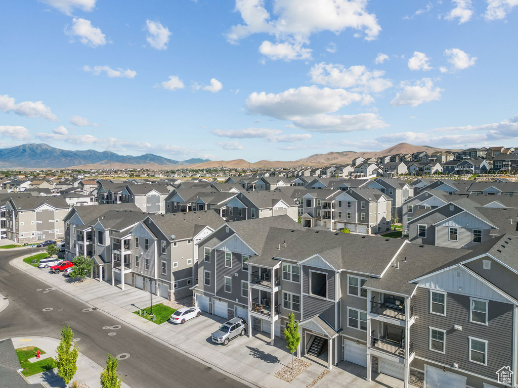 Aerial perspective of suburban area featuring a mountainous background