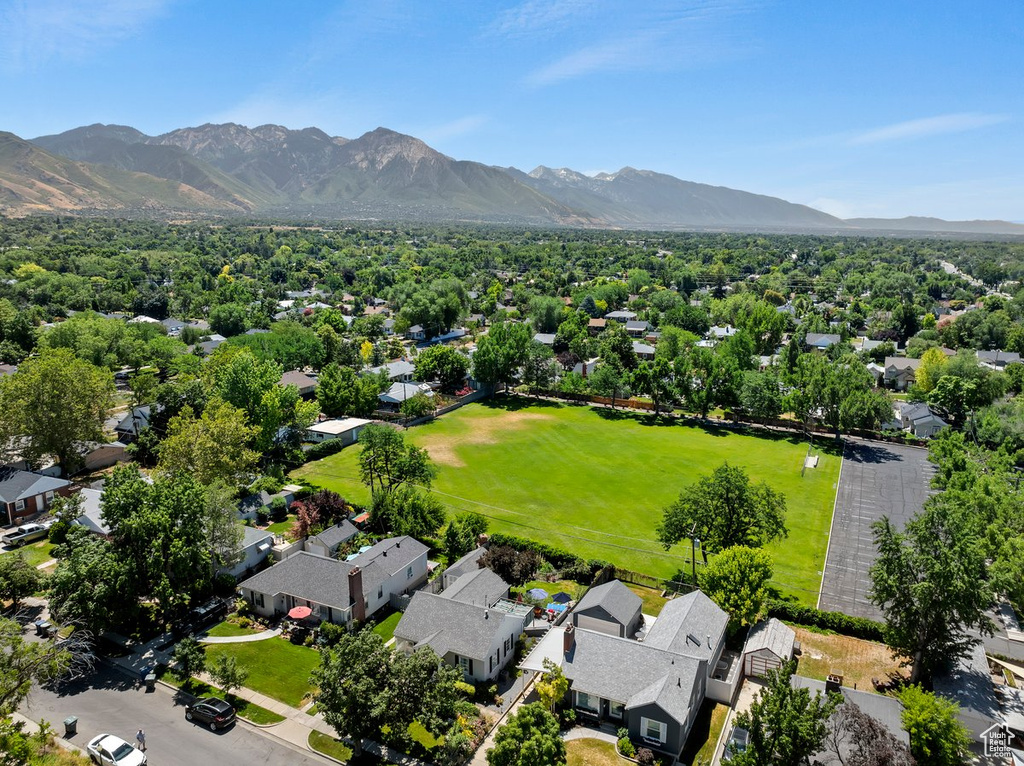 Aerial view of residential area featuring a mountain backdrop