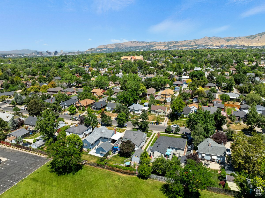 View of property location featuring a mountain backdrop and nearby suburban area