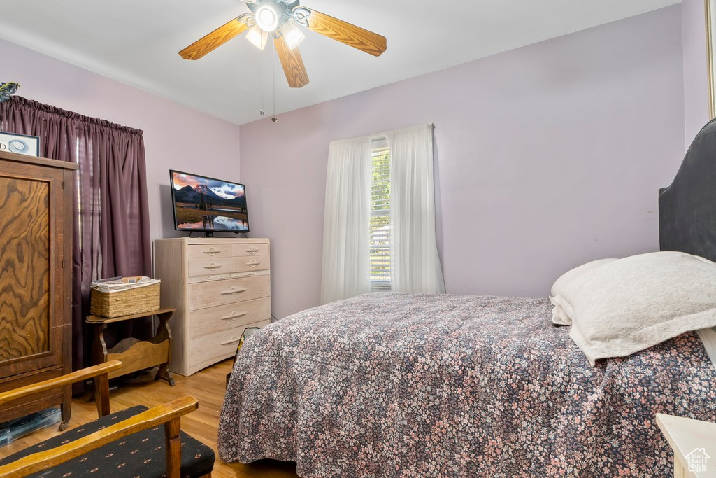 Bedroom featuring light wood finished floors and a ceiling fan