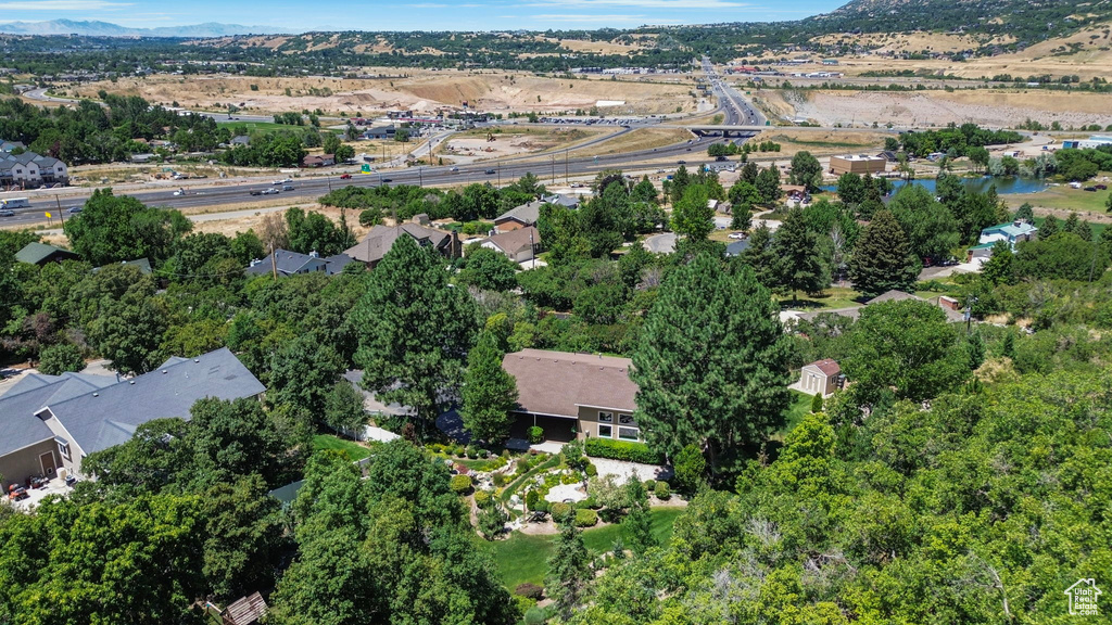 Aerial overview of property\\\\\\\'s location with a mountain backdrop and nearby suburban area