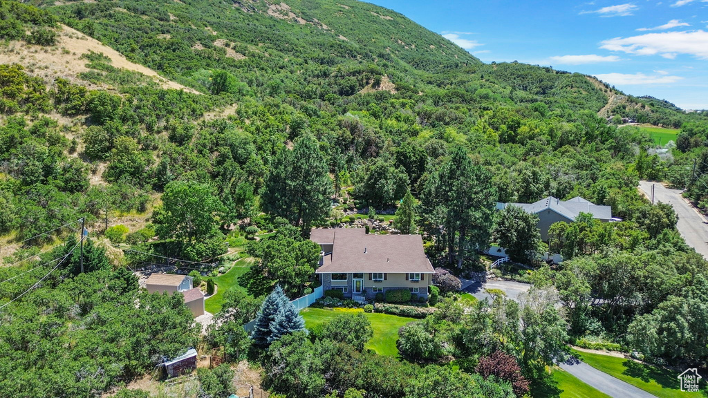 View of subject property with a heavily wooded area