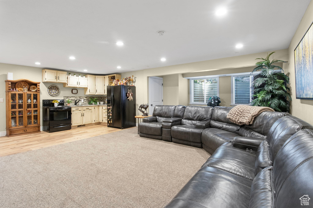 Living room featuring recessed lighting and light wood-style floors