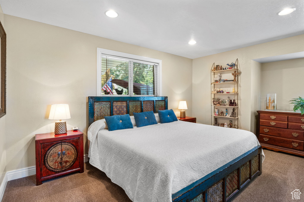 Carpeted bedroom with recessed lighting