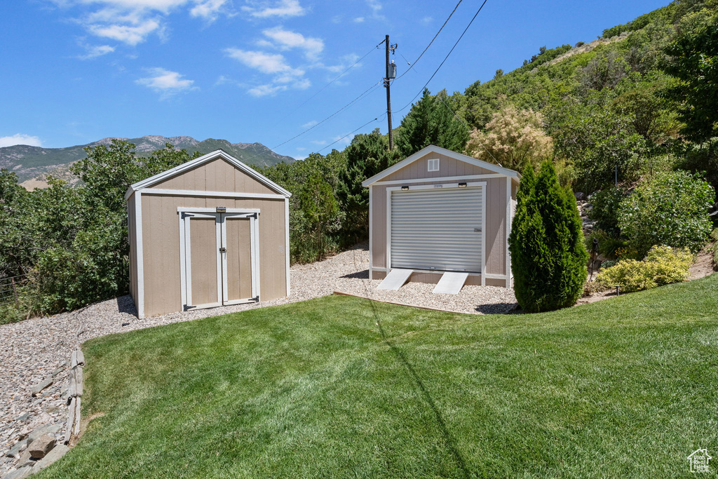 View of shed with a mountain view