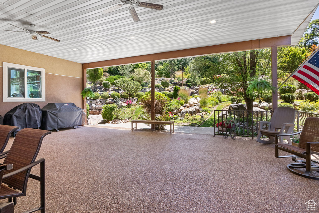 View of patio / terrace with ceiling fan and a grill