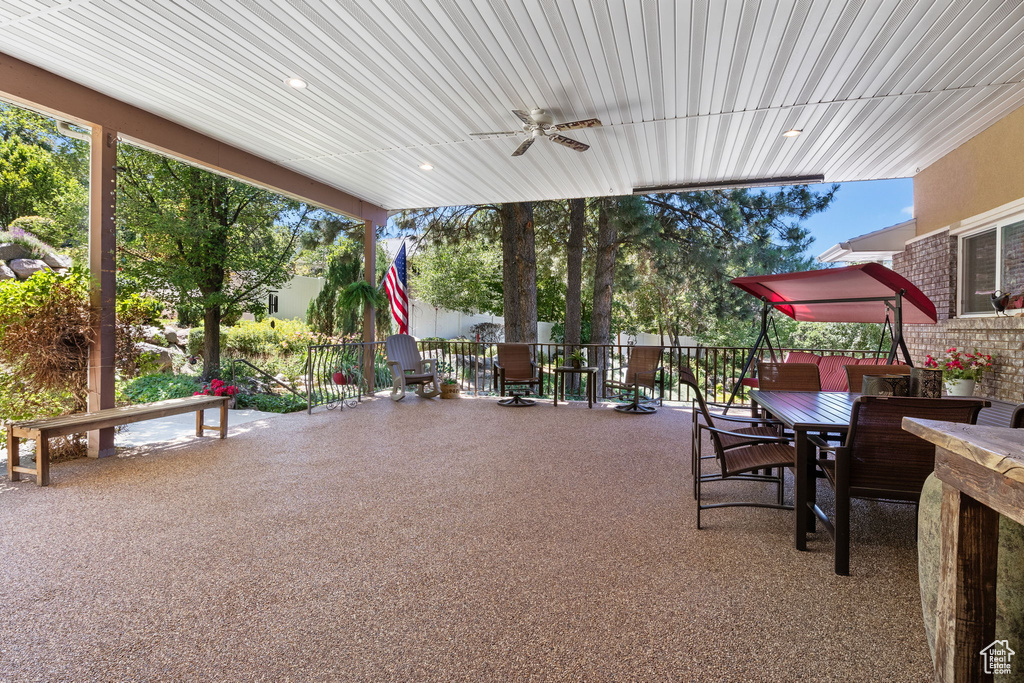 View of patio featuring ceiling fan and outdoor dining area