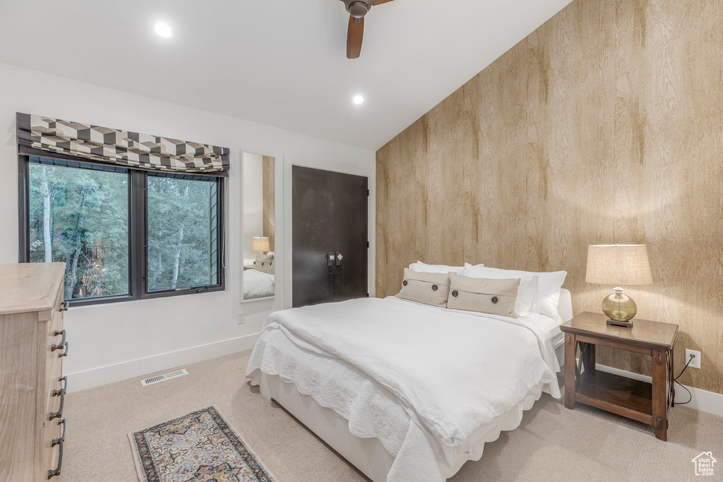 Carpeted bedroom with recessed lighting and ceiling fan