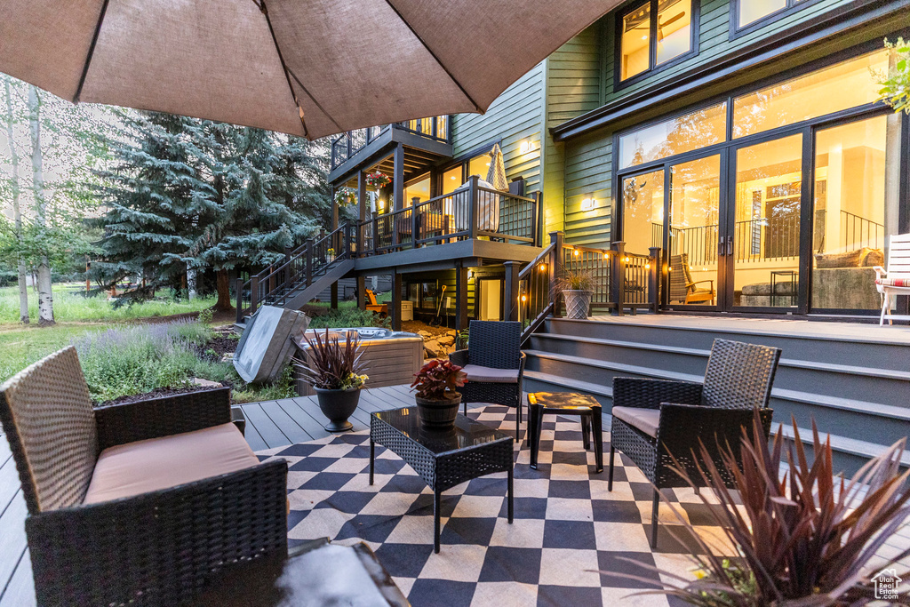 View of patio / terrace with stairway, a wooden deck, and an outdoor living space