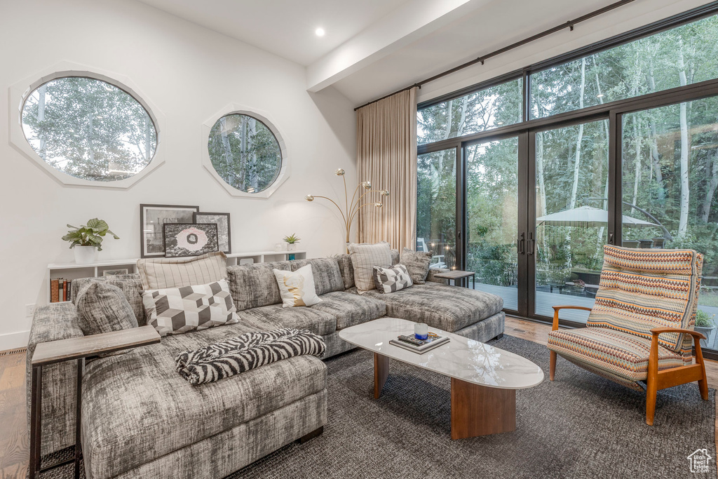 Living room featuring wood finished floors, french doors, and recessed lighting