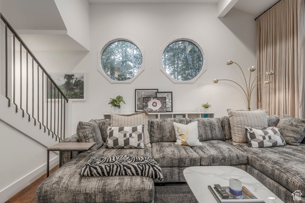 Living area featuring wood finished floors and stairs