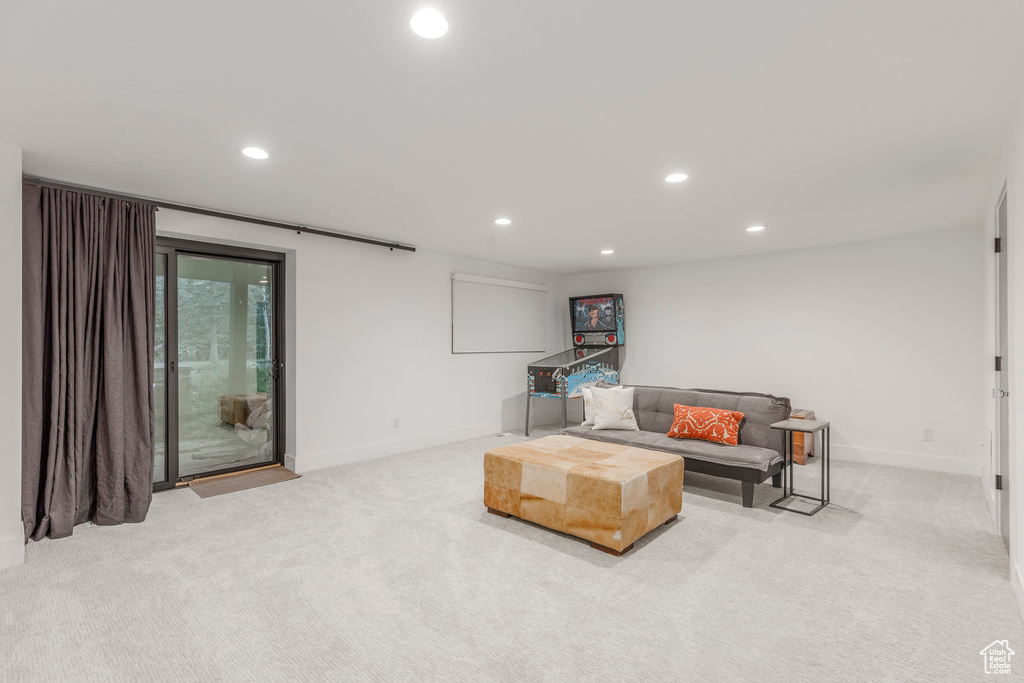 Living room with recessed lighting and light carpet