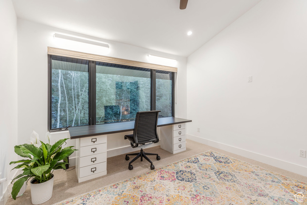 Office with built in desk, light colored carpet, recessed lighting, and lofted ceiling
