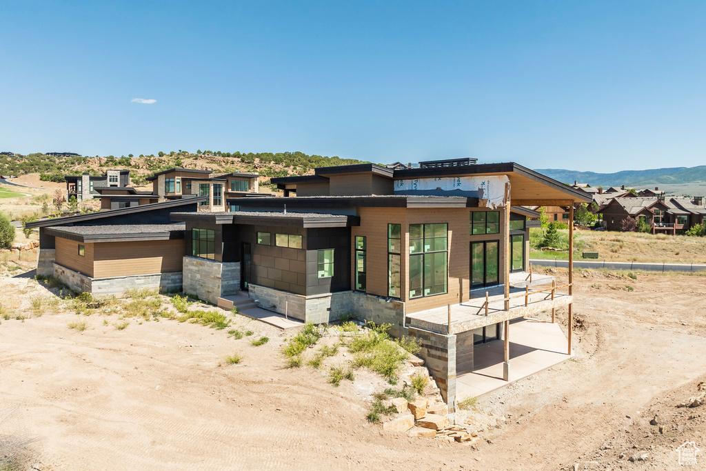 View of front of property with a mountain view