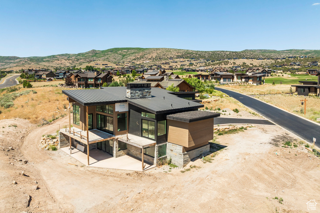 Aerial perspective of suburban area with a mountain backdrop
