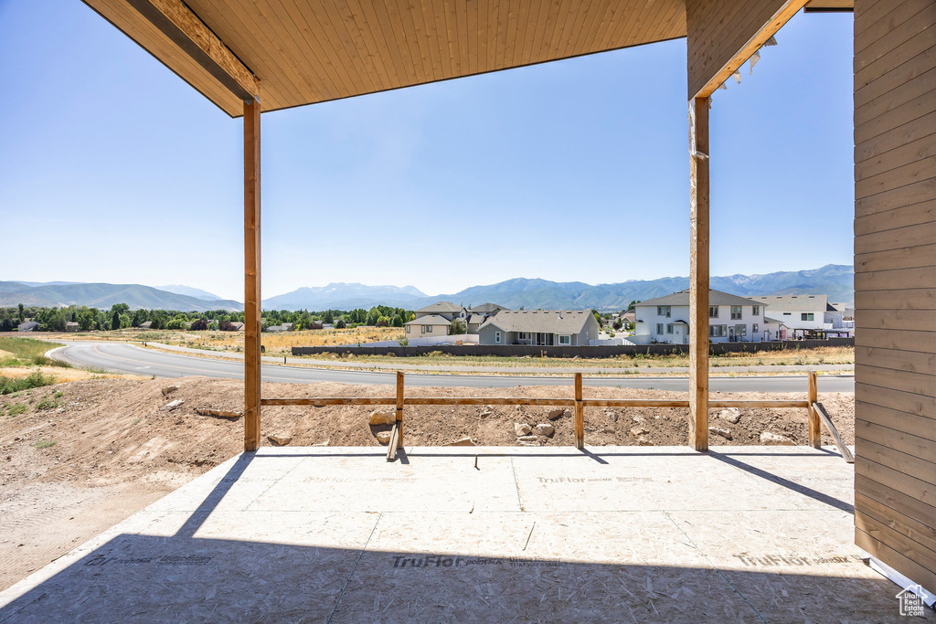 View of patio / terrace featuring a mountain view and a residential view