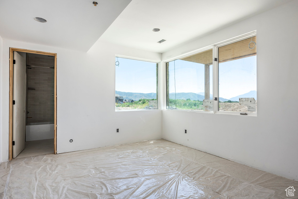 Unfurnished bedroom with a mountain view