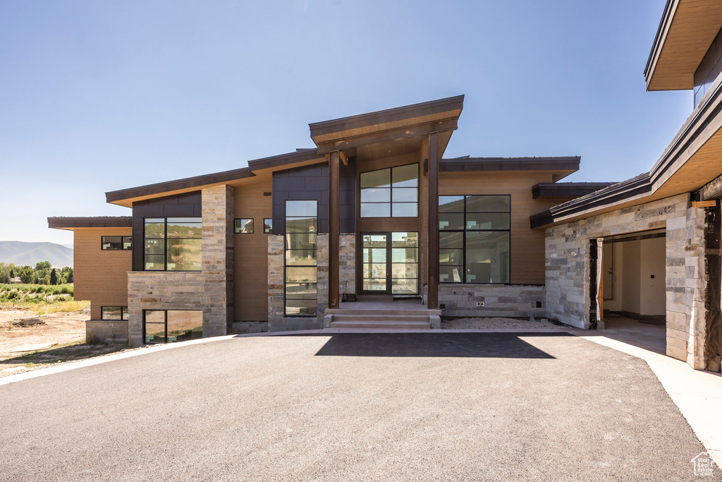 Entrance to property with stone siding