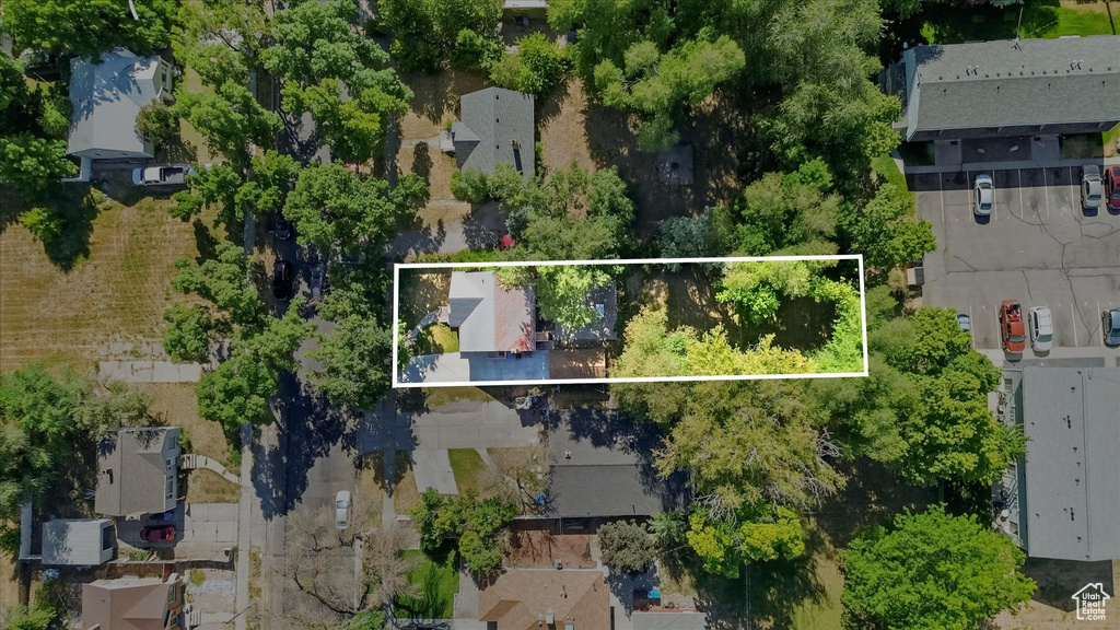 Aerial perspective of suburban area featuring property boundaries highlighted