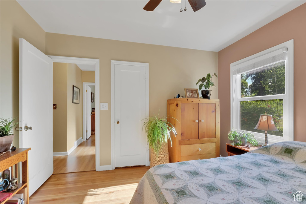 Bedroom featuring light wood-type flooring and a ceiling fan