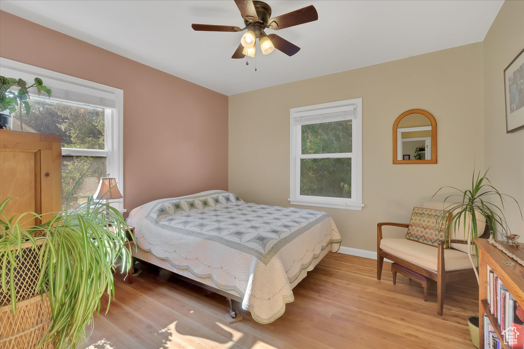 Bedroom with light wood-type flooring and ceiling fan