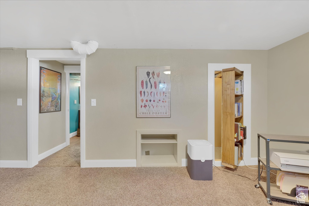 Carpeted bedroom with baseboards