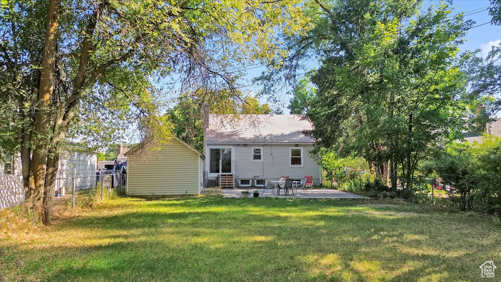 Back of property with a patio and entry steps