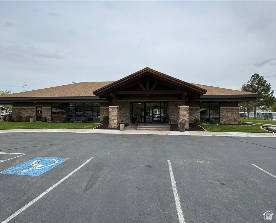 View of property with uncovered parking