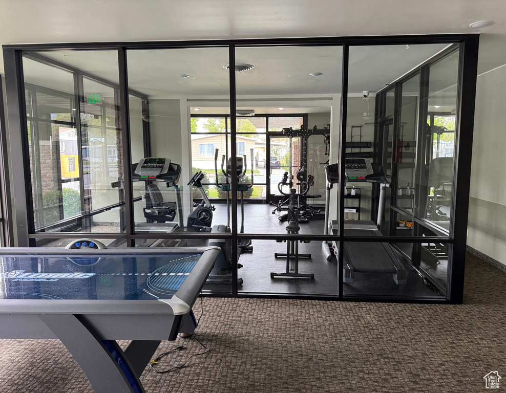 Gym with floor to ceiling windows