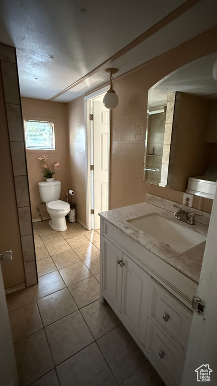 Bathroom with vanity and tile patterned flooring