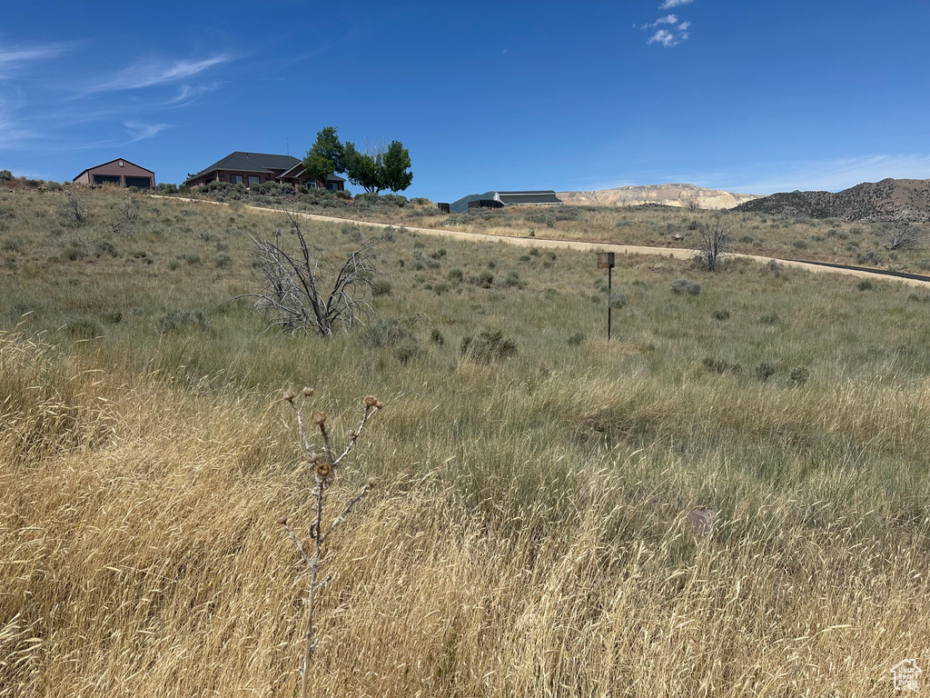 View of mountain backdrop featuring rural landscape