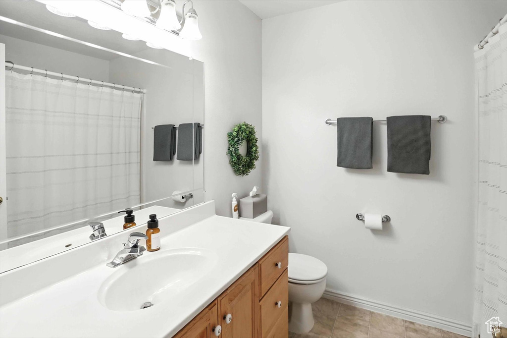 Full bath with toilet and vanity