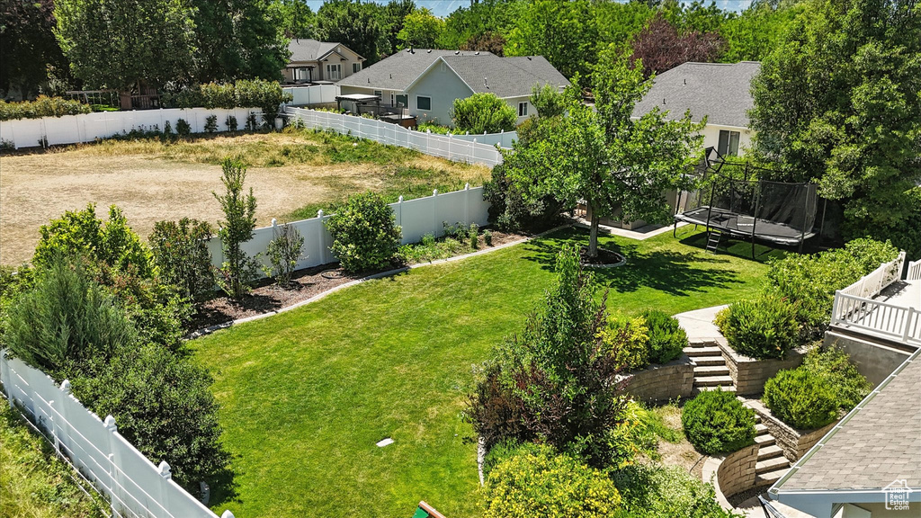 Fenced backyard with a residential view