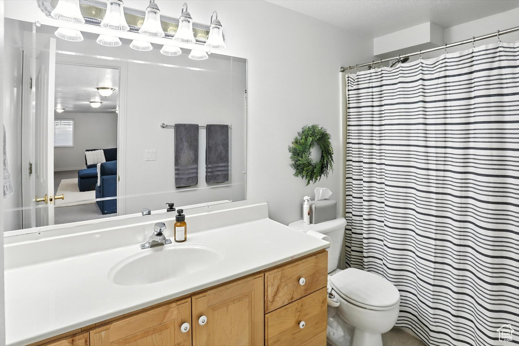 Bathroom featuring vanity and a shower with curtain