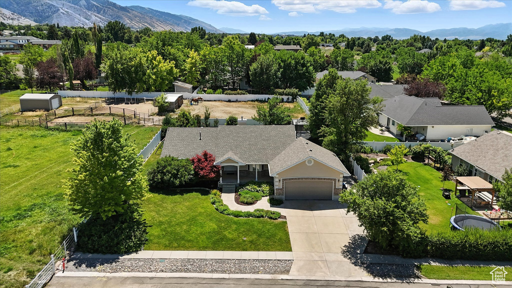 Aerial perspective of suburban area with a mountainous background