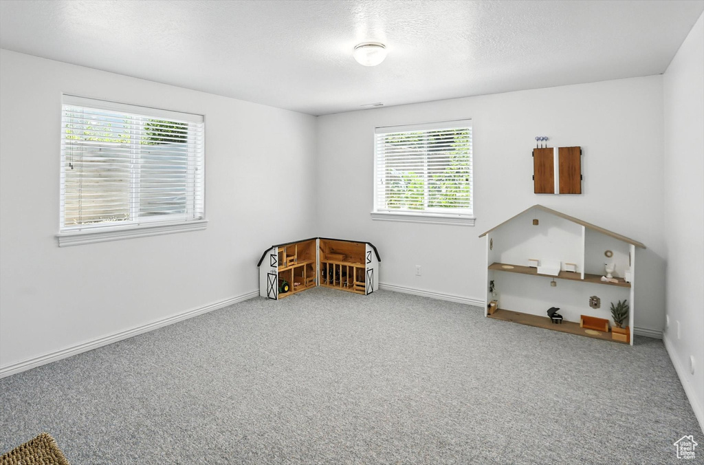Bedroom with carpet floors and baseboards