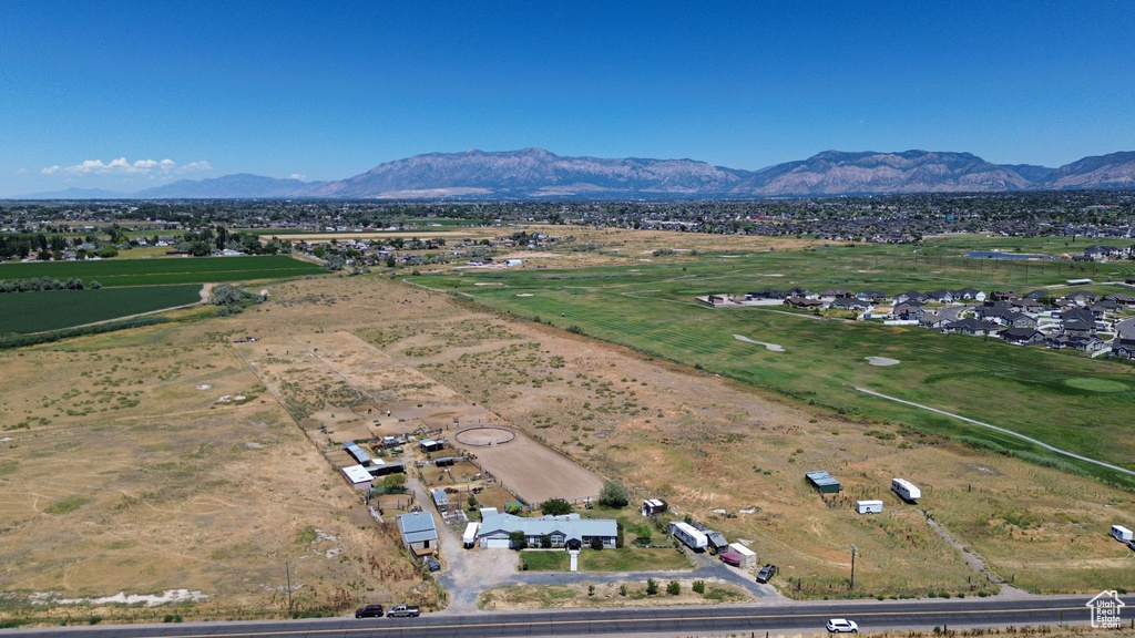 Aerial overview of property\'s location with a mountainous background