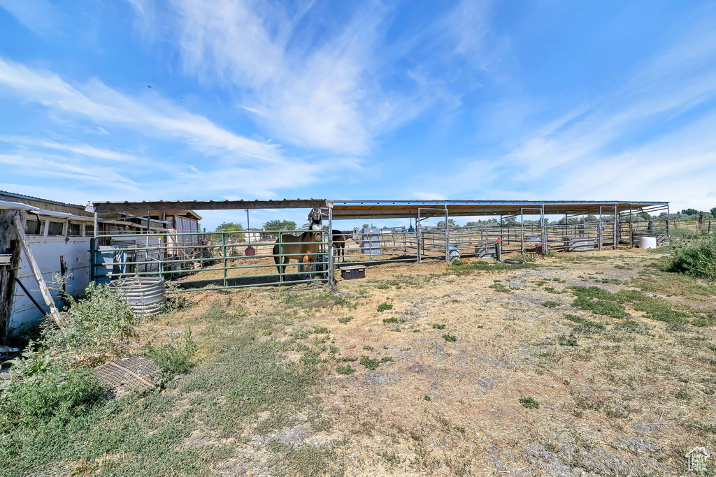View of yard with an exterior structure and an outdoor structure