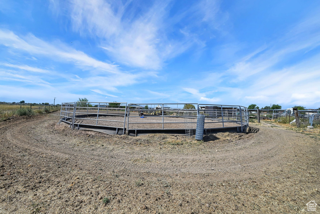 Horse barn featuring a rural view