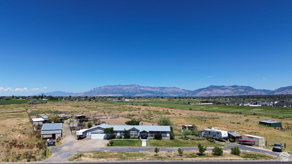 View of mountain backdrop with rural landscape