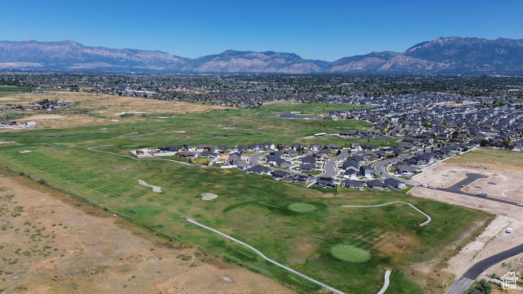 Aerial view of property\'s location with a mountainous background and nearby suburban area