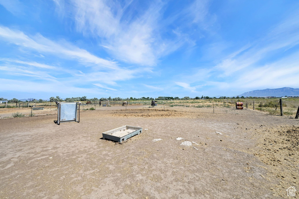 View of yard with a view of countryside and a mountain view