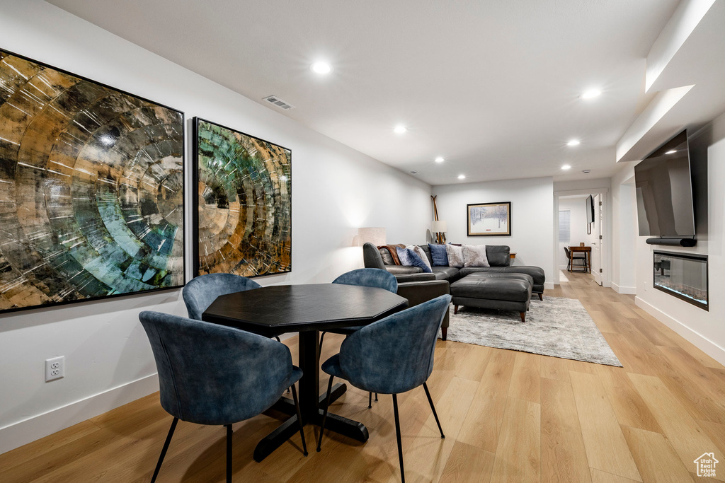 Dining area featuring recessed lighting and light wood-style floors