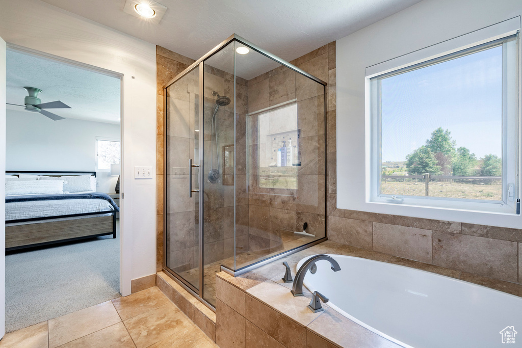 Ensuite bathroom with a garden tub, a shower stall, tile patterned flooring, and a ceiling fan