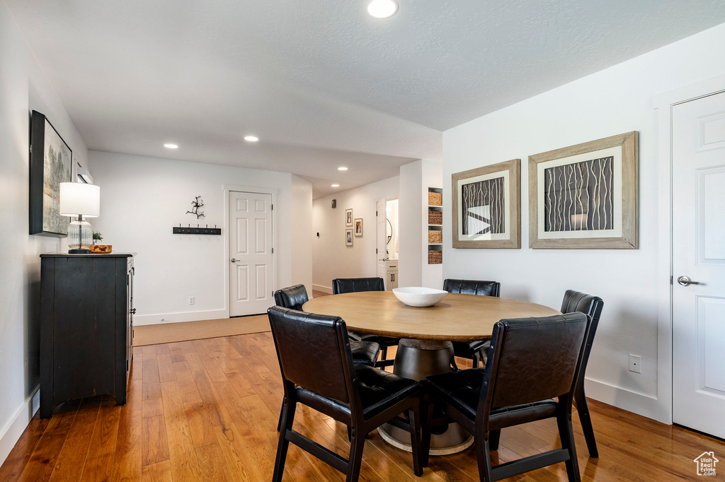 Dining room featuring light wood-style floors and recessed lighting