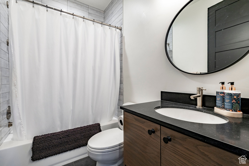 Full bathroom with vanity and shower / bath combo