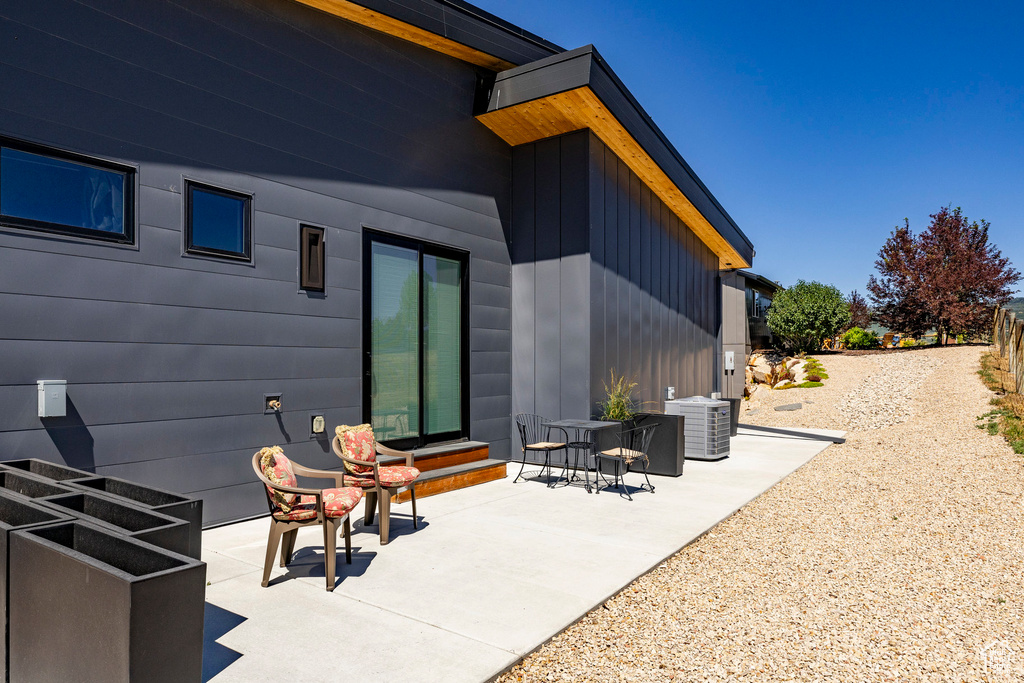 Back of house with a patio