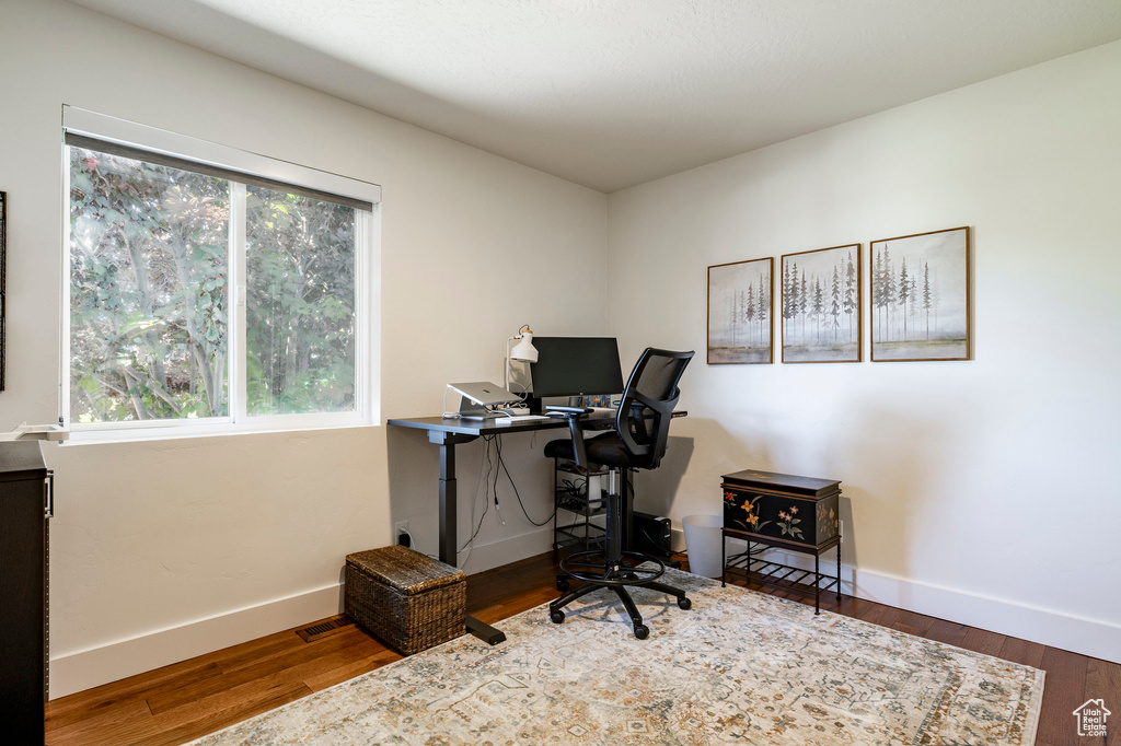Office space featuring wood finished floors