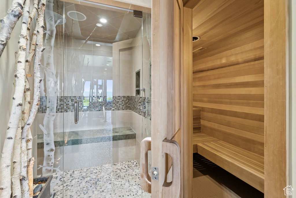 Full bathroom featuring a stall shower, a sauna, and recessed lighting