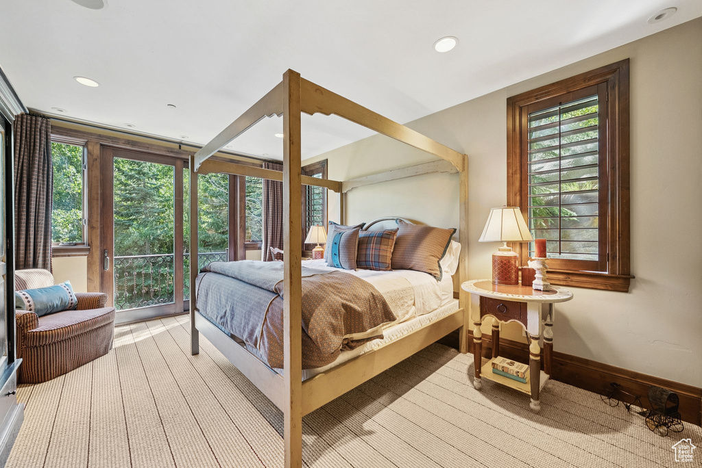Bedroom with access to outside, recessed lighting, and light wood-type flooring
